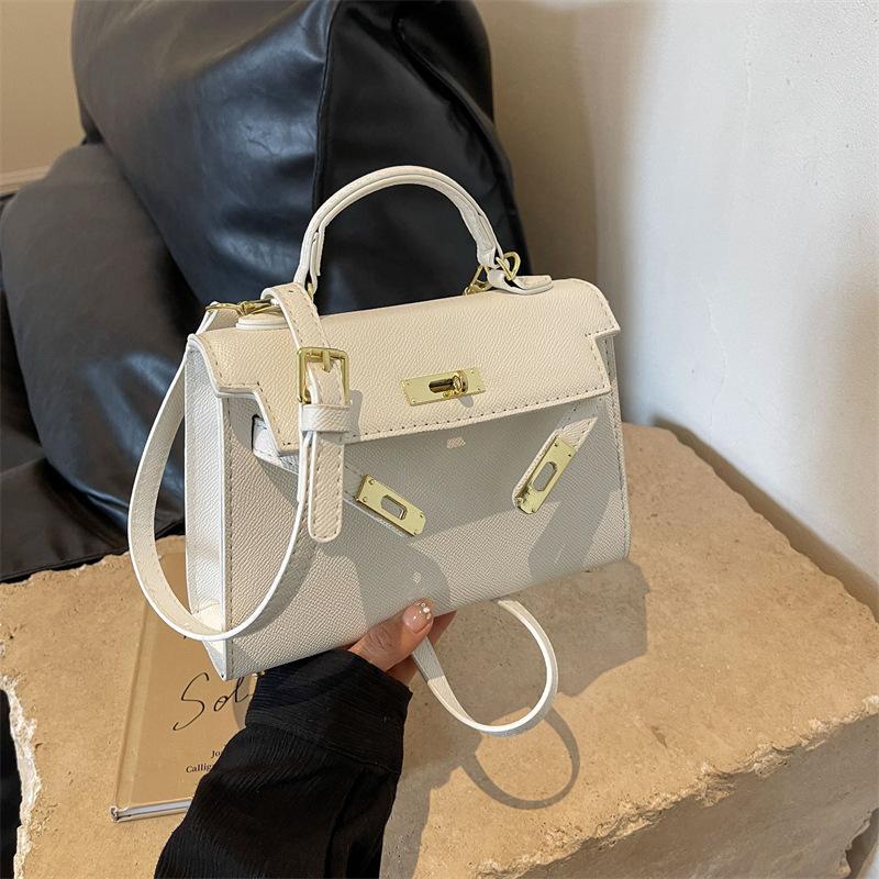 New fashionable solid color cross pattern portable shoulder oblique span trendy women's bag