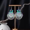Bohemian Ethnic Miao Silver Tassel Earrings with Butterfly, Peacock, and Flower Design for Women – Long Dangle Jewelry for Travel Photos.