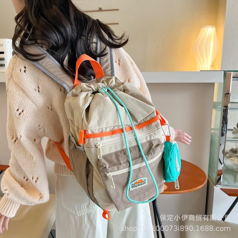 Schoolbag Korean contrasting color Macaron backpack 1011 new lightweight and cute kindergarten schoolbag drawstring backpack wholesale