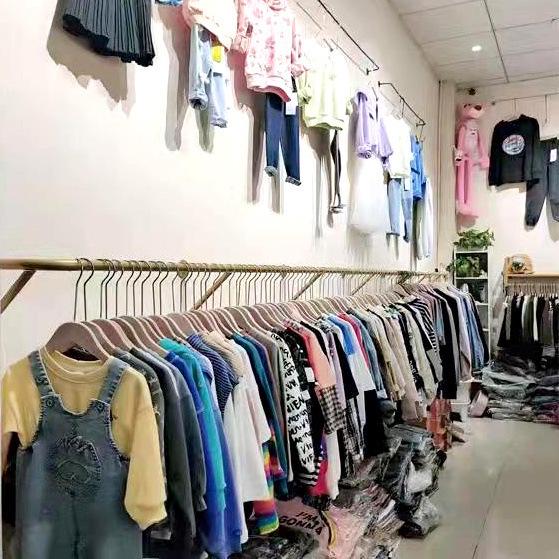 Wall-Mounted Clothing Display Rack for Women's and Children's Wear Stores