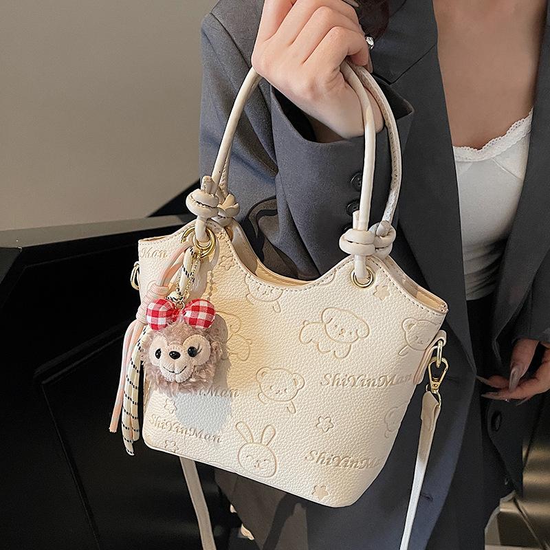 2025 new casual niche cute print high-end portable bucket bag fashionable women's commuter style messenger bag