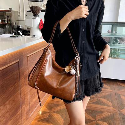 Borsa a tracolla retrò da donna: Zaino e borsa da viaggio capienti e versatili.