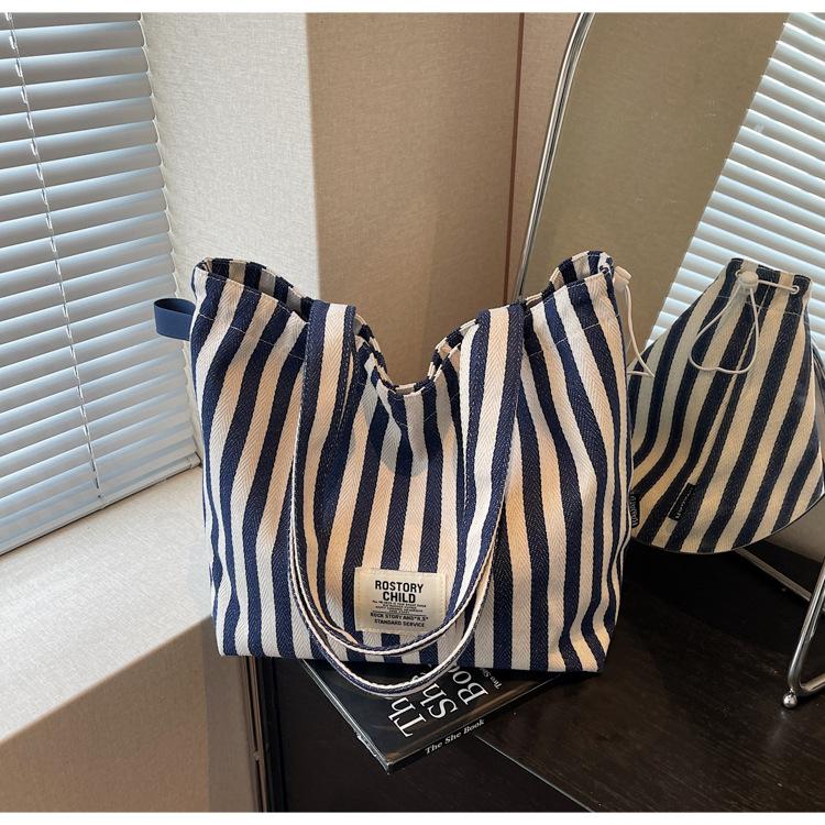 

Spring new literary niche literary double-sided back shoulder bag casual striped simple handbag синій