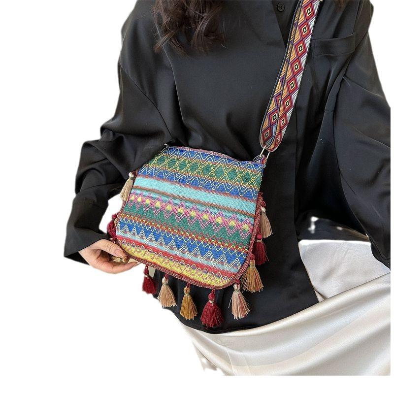 High-value ethnic style messenger bag women's 2025 new trendy versatile wide shoulder strap shoulder bag fringed bucket bag women