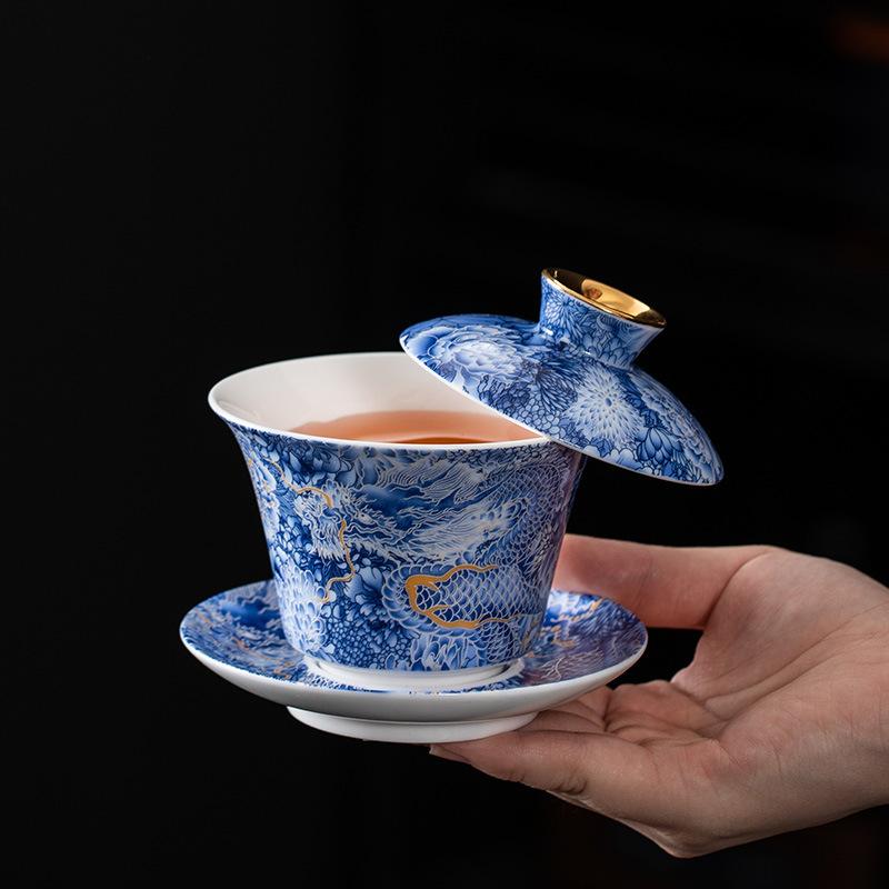 Chinese hoverable cover bowl blue and white gold and silver wrong suet jade porcelain three-color cover bowl Kung Fu household cover bowl tea bowl