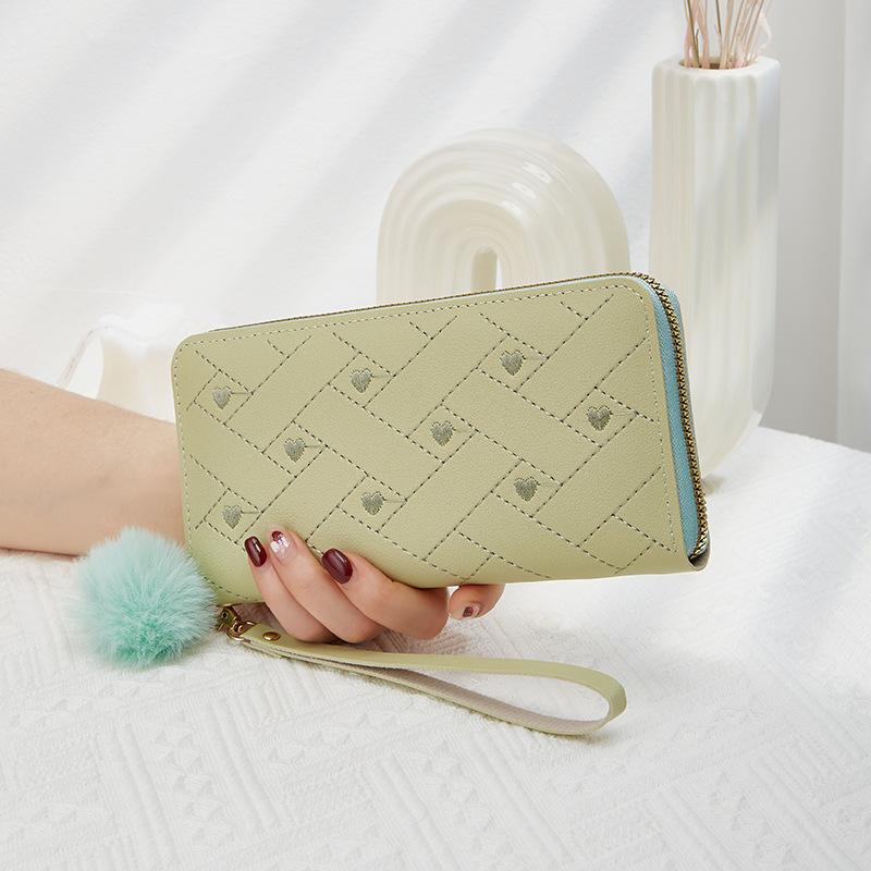Spring and summer new women's wallet indentation medium and long clutch bag trendy love hairball change mobile phone bag