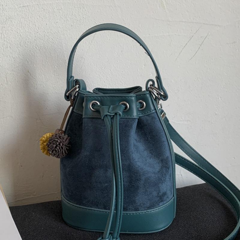 Stylish and simple contrasting color bucket bag women's autumn new shoulder messenger bag high value casual strap handbag