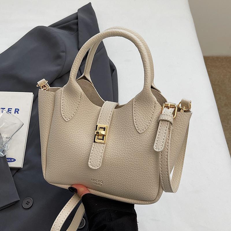 Wholesale hot sale simple temperament light luxury lychee pattern portable bucket bag niche design versatile commuter messenger bag