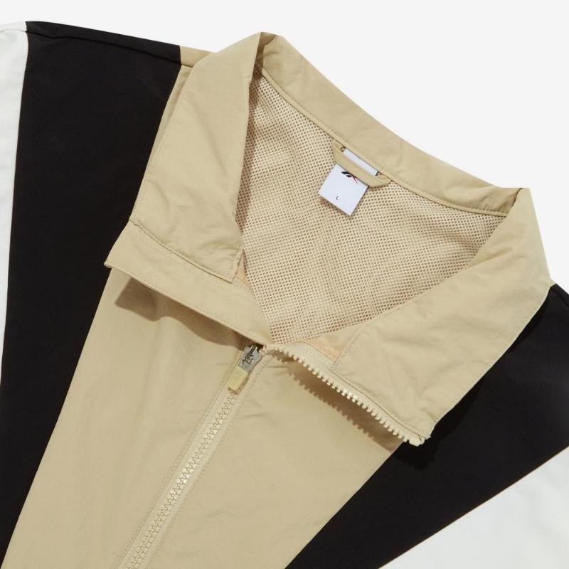 Reebok Giacca Antivento Bicolore a Blocchi con Collo Alto Twin Vector Confortevole Traspirante con Zip Intera Giacca Unisex Beige REJU4EJ39I2
