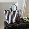 This Water-Resistant Pvc Tote Bag Features A Pink And Blue Striped Design, A Large Capacity, And Is Suitable For Beach Shopping,