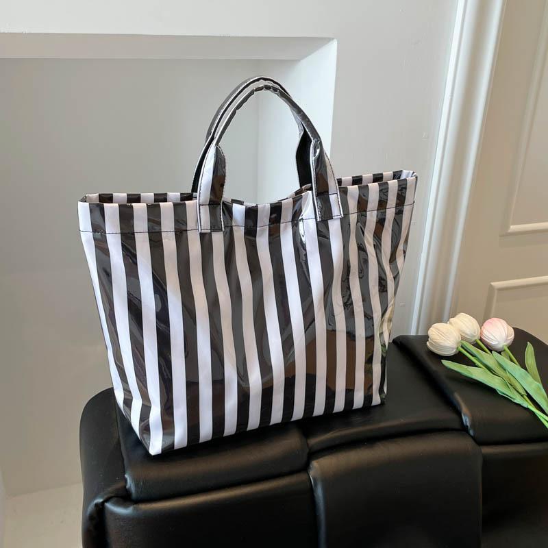 This Water-Resistant Pvc Tote Bag Features A Pink And Blue Striped Design, A Large Capacity, And Is Suitable For Beach Shopping,