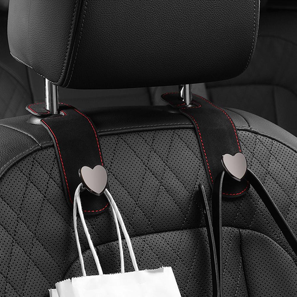 Kopfstützenhaken für Autositze 2 in 1 Leder Herzform Metall Rückenlehnenhaken Handtaschen- und Taschen-Rucksack Doppelhaken Sitzaufhänger