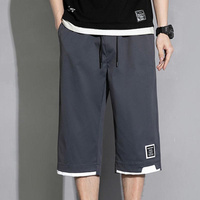 Pantaloncini estivi versatili casual da uomo Koreon Streetwear Fashion Elastico in vita Pantaloni larghi cachi neri verdi Taglie forti 8XL