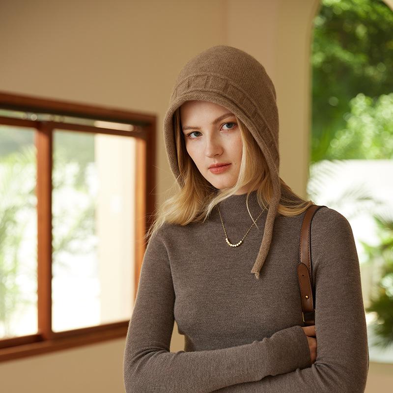A New Autumn and Winter Style Women's Knitted Cap with A Solid Color Warm and Ear Protecting Edge  Featuring A Rolled Up Jacquard Strap