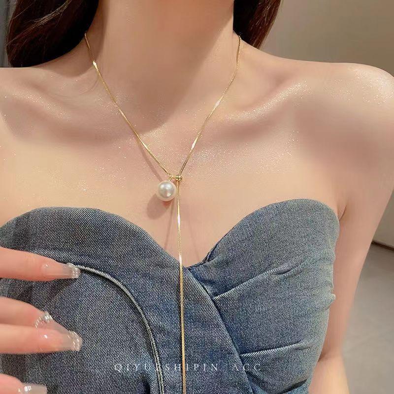 

Cold pull pearl long necklace women s high sense niche design temperament celebrity sweater neck chain