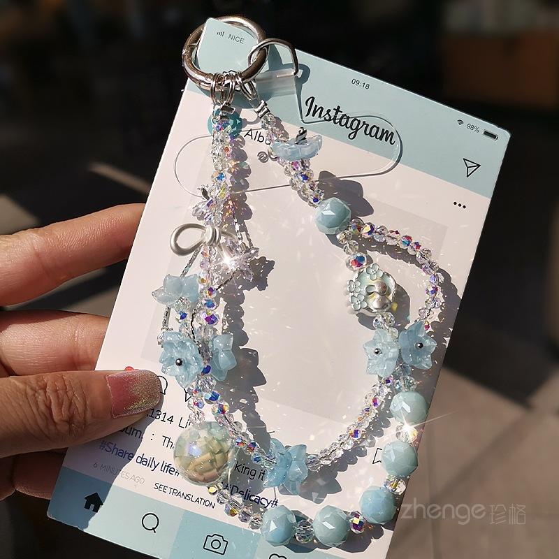

Handmade crystal mobile phone chain ins style niche light luxury wrist pendant women s high-end pendant bracelet short blue flower butterfly crystal bracelet