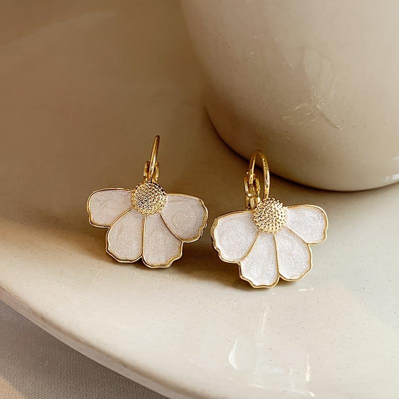 A pair of elegant French-style floral drop earrings, featuring a delicate four-petal flower design, perfect for everyday wear, parties, and vacations.