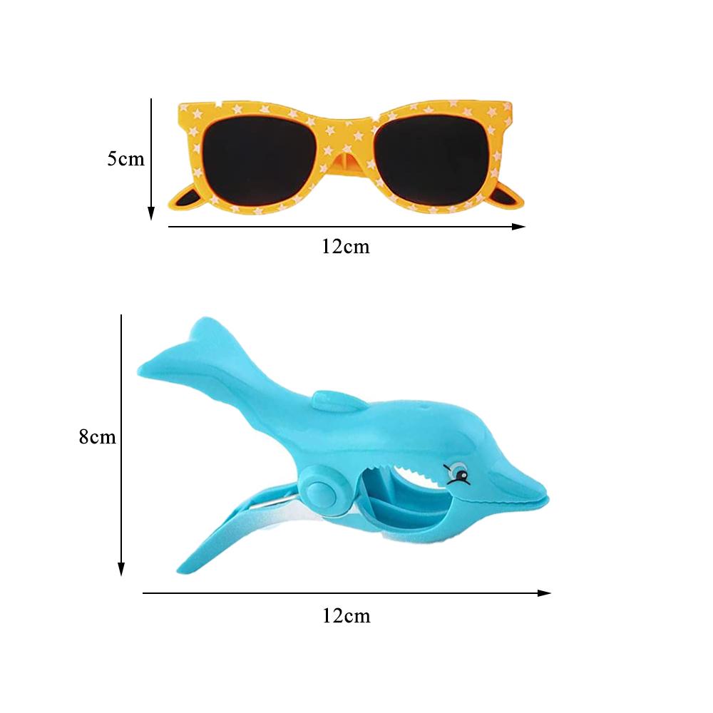 Klipy na plážové ručníky na terasu a k bazénu zahrnují sluneční brýle Flamingo Dolphin Slipper