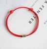 Adjustable Red String Bracelet with Small Patterned Metal Bead Handmade Woven Cord Bracelet for Everyday Wear