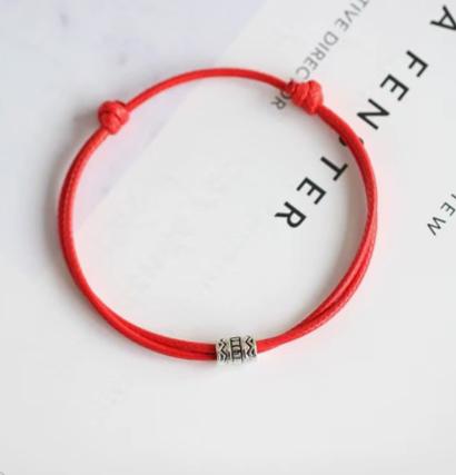 Adjustable Red String Bracelet with Small Patterned Metal Bead Handmade Woven Cord Bracelet for Everyday Wear