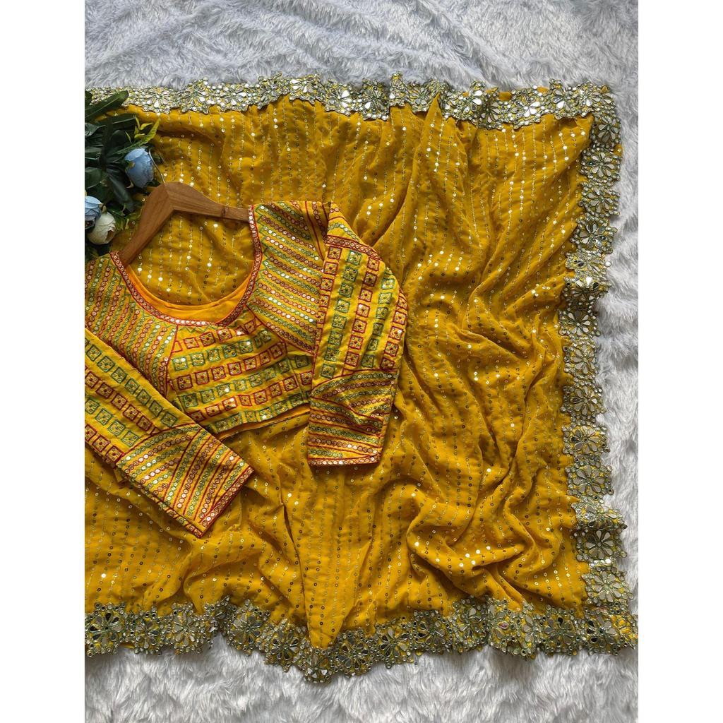 Lanzando un hermoso sari de fiesta de color amarillo con trabajo de espejo de diseño