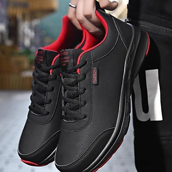 Quanzhou autumn leather sneakers waterproof and non-slip running shoes black soft-soled casual shoes