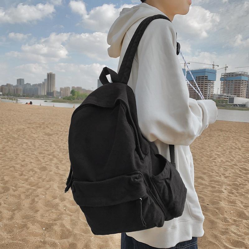 

Simple solid color canvas backpack large capacity travel backpack leisure junior high school student couple schoolbag чорний