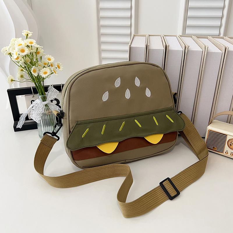 

Korean version of cute burger canvas shoulder bag 2025 new personalized cartoon backpack girl heart messenger bag gift зелений