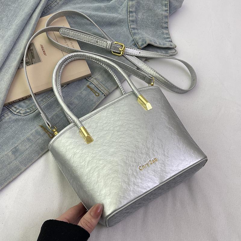 

Popular niche simple portable bucket bag retro solid color versatile high sense commuting PU messenger bag women