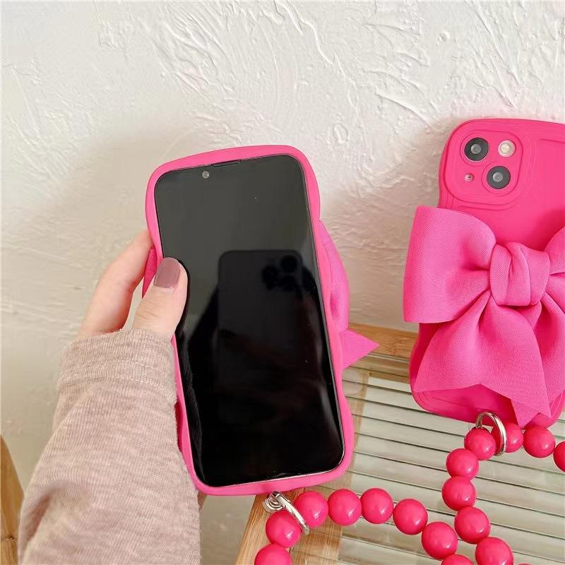 Rose red bow wristband is suitable for Apple 14 mobile phone case, new iPhone13promax women's 12 three-dimensional 11.