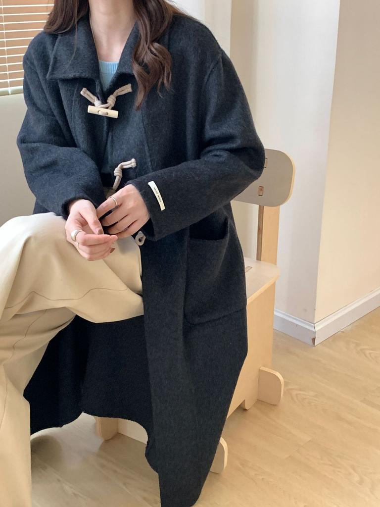 New double-sided wool coat, long big pocket horn wood buckle doll collar, thickened long wool cashmere coat.