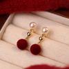 Retro temperament autumn and winter red pom-pom pearl stud earrings women's light luxury high-end temperament natal year earrings New Year