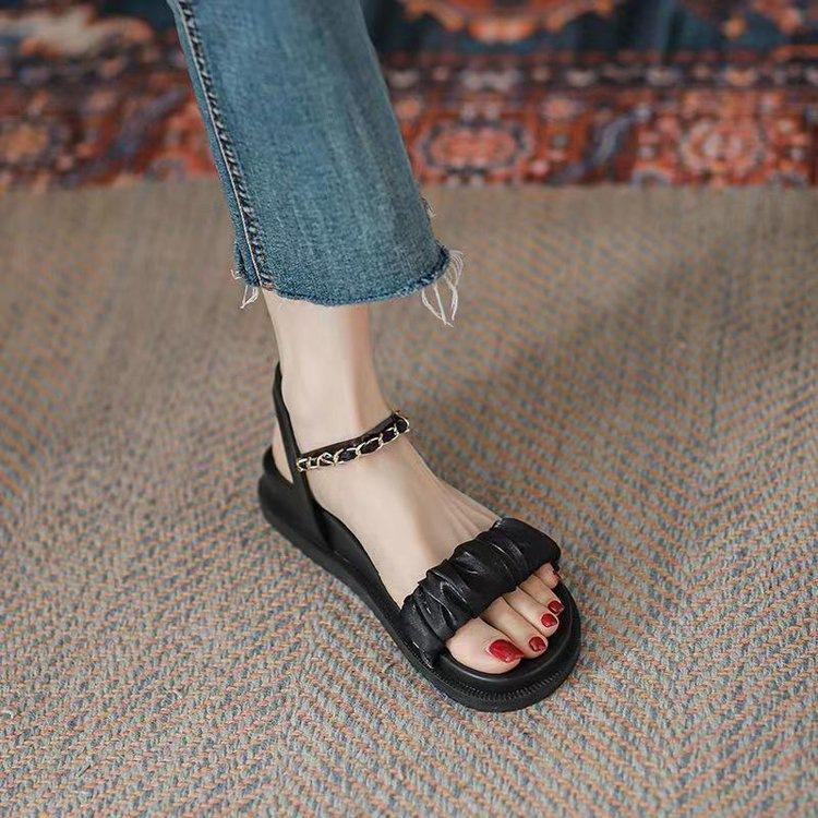 

Sandals women s summer 2025 new flat bottom word with versatile fairy wind platform muffin Internet celebrity Roman shoes 35