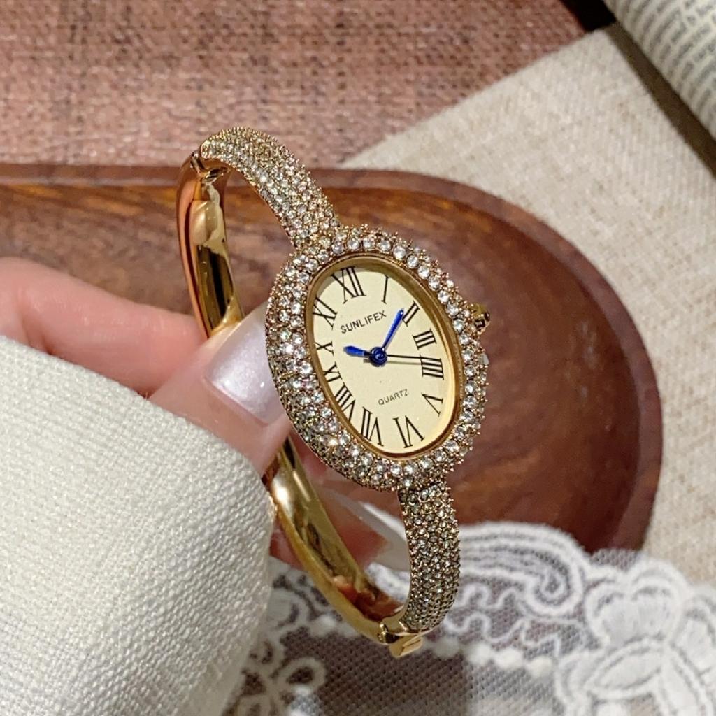 Sunlifex Diamantbesetzte ovale Zifferblatt Armbanduhr für Damen Quarzarmband Berühmte Marke Damenarmbanduhren Saati Relojes