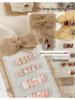 Original Handmade Retro Nail Art Display Board with Burlap Bow and Wearable Nails Pattern.