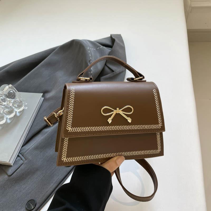 

Textured foreign style small bag women s 2025 summer new popular bow sweet solid color messenger bag small square bag кавовий