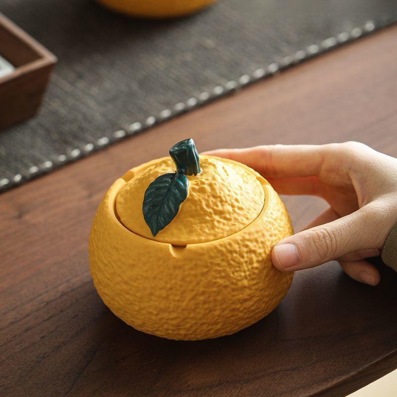 Resin Orange Ashtray with Lid - Creative, Anti-Fly, Stylish Living Room or Office Decor.