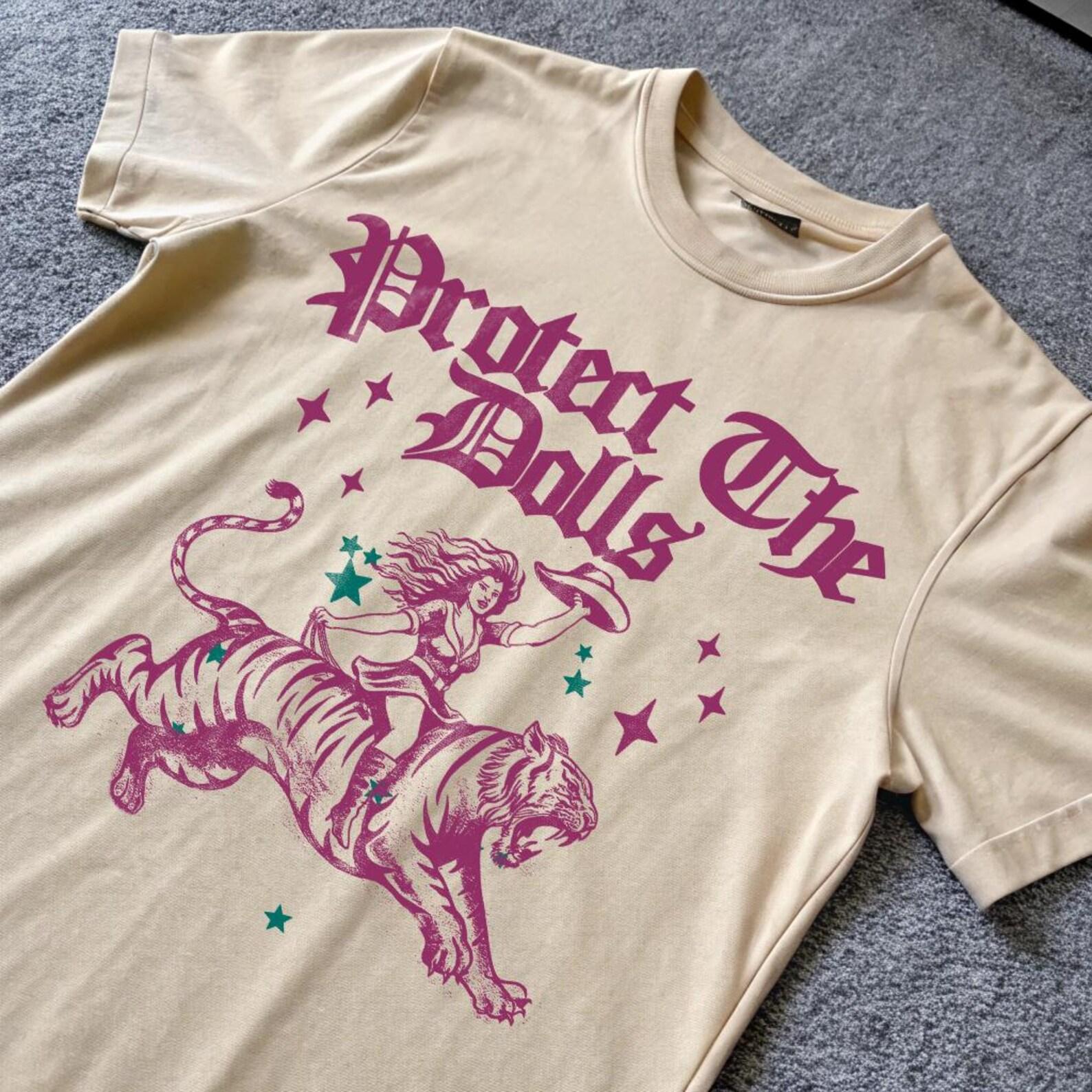 Protect The Dolls, Vintage Feminist Shirt, Human Rights Tee, Activist Slogan Shirt, Cute Y2k Cowgirl Riding Tiger Meme T-Shirt S