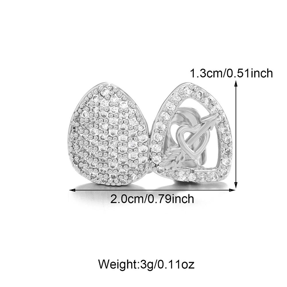 

Двойные грилзы «Сердце и стрела»: Причудливые циркониевые зубные украшения с медной оправой для Хэллоуина