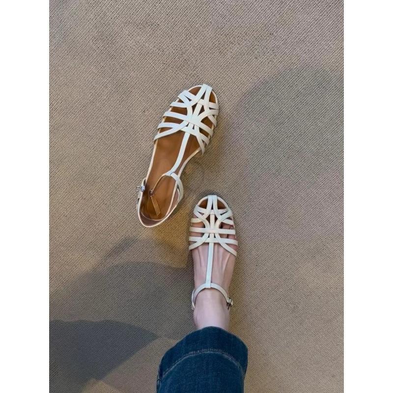 Gewebte Retro-Hohl-Atmungsaktive Sandalen Damen 2025 Sommer Neue Flachboden-Freizeit-Vielseitige Ein-Wort-Schnallenriemen Römerschuhe