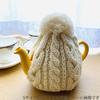 This Smoked Tea Cozy from the Home of Authentic British Tea, Fits 4 Cups (1200ml), Is Made In England from 100% Wool and Cable Knit. The Carefully