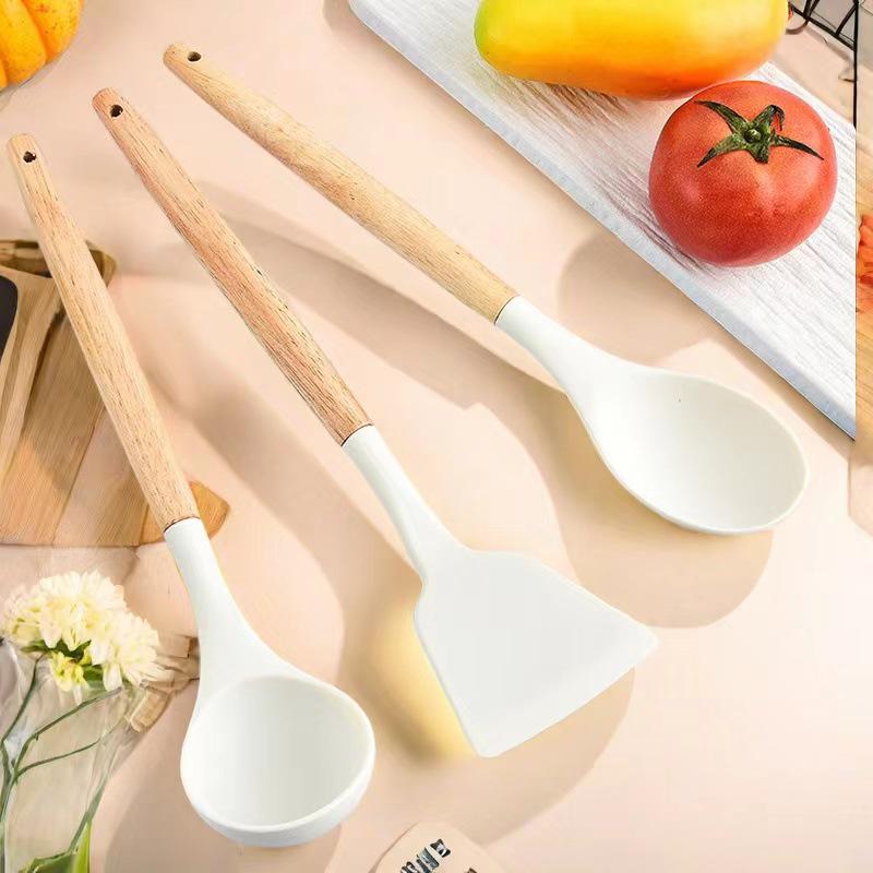 12-Piece Silicone Cookware Set with Wooden Handles - Non-stick, High-Temperature Resistant, Includes Spatula and Soup Ladle.