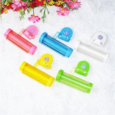 New Useful Plastic Toothpaste Rolling Tube Squeezer Easy Dispenser Bathroom Holder