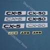 For Mazda CX-50 Black Front Logo, Middle Grille Sticker, CX-5 Rear Logo, Luggage Compartment Logo Accessory Sticker Carbon Fiber Xlnpu00