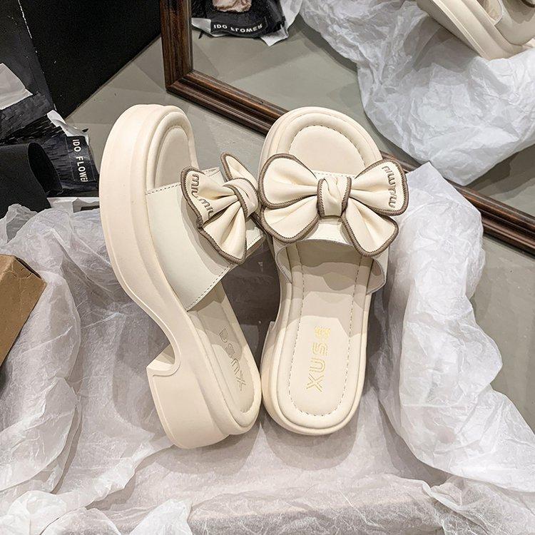 Thick-bottomed slippers women summer wear Internet celebrities thick-bottomed bows one-word slips heightening fashion super fire fairy wind sandals