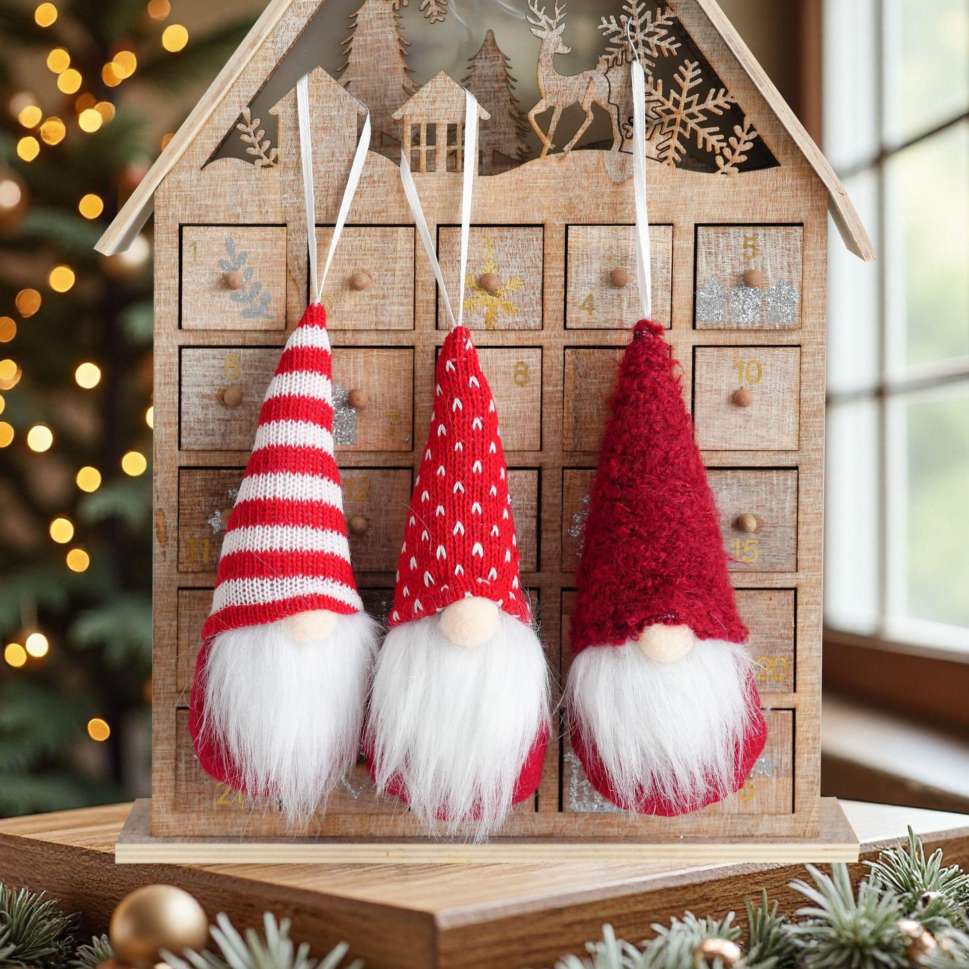 

A set of three Christmas tree pendants. The red pendant of the faceless old Man on the Christmas tree is suitable for Christmas