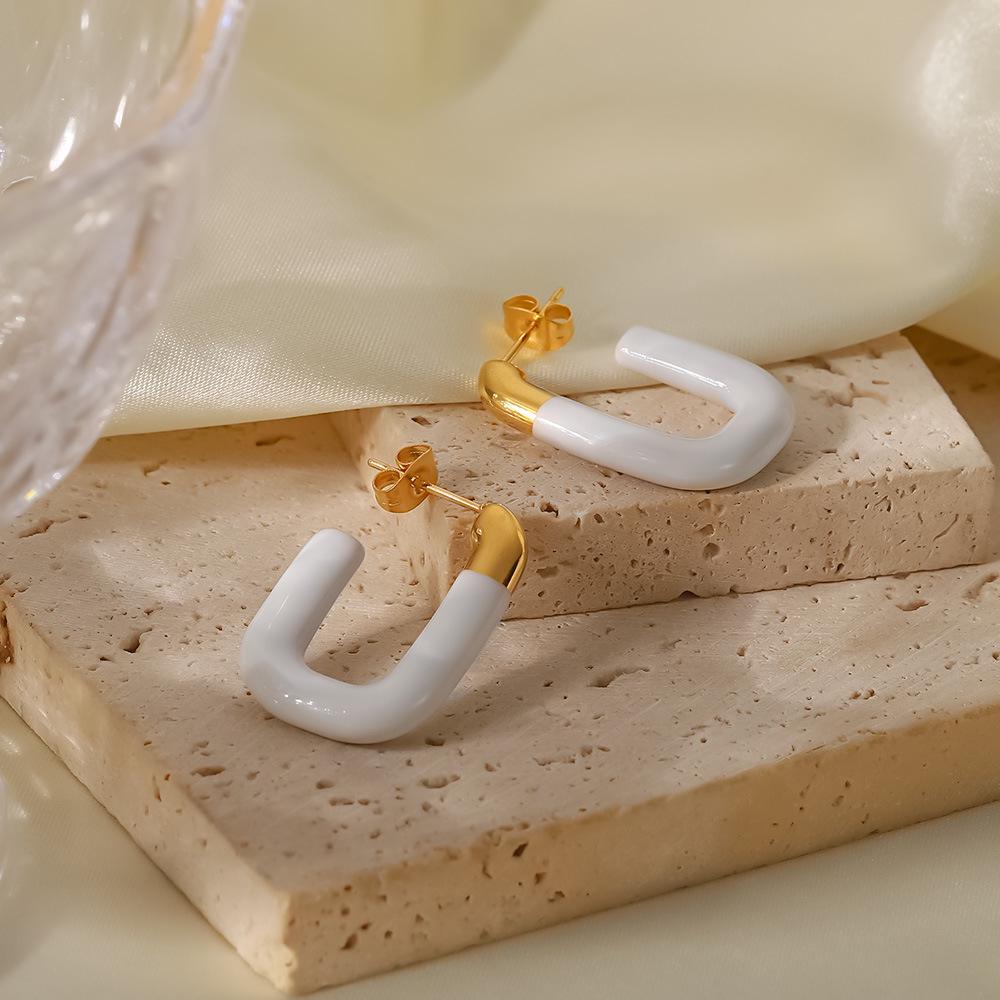 

Gold-Plated Stainless Steel Earrings with Creative White Enamel Design