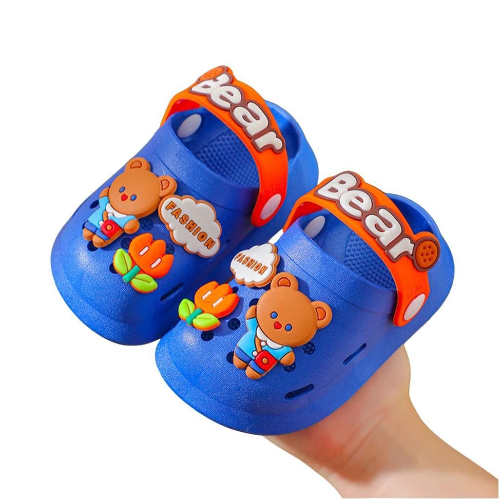 Nuove graziose pantofole a forma di cartone animato per bambini che imparano a camminare