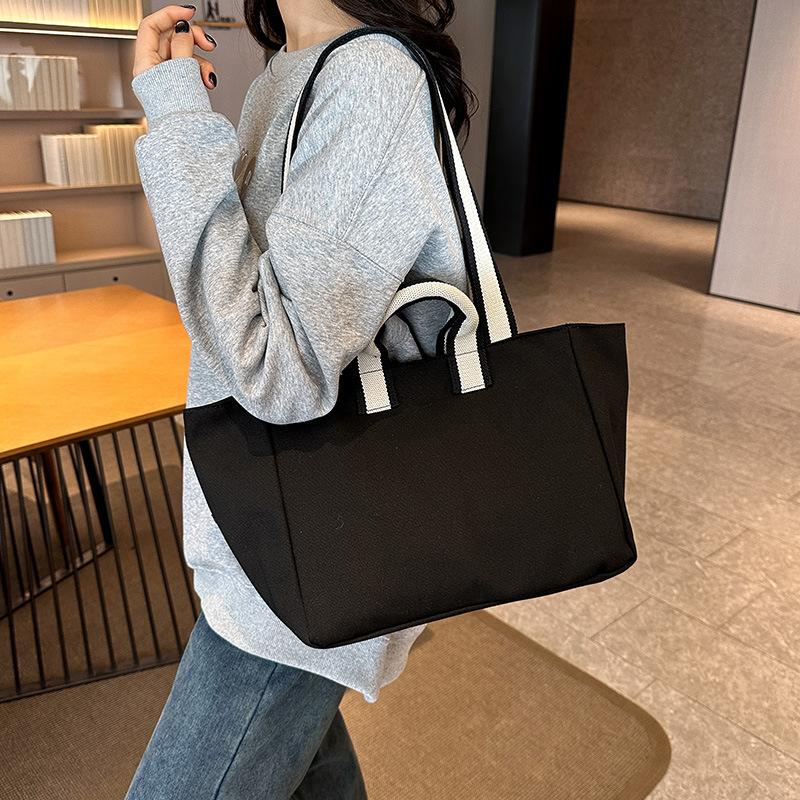 Shoulder bag women's 2025 autumn new trend large-capacity tote bag fashion simple college style commuter canvas bag
