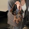Korean version of trend, high-end printing temperament, portable bucket bag, niche fashion commuting versatile light luxury messenger bag, women